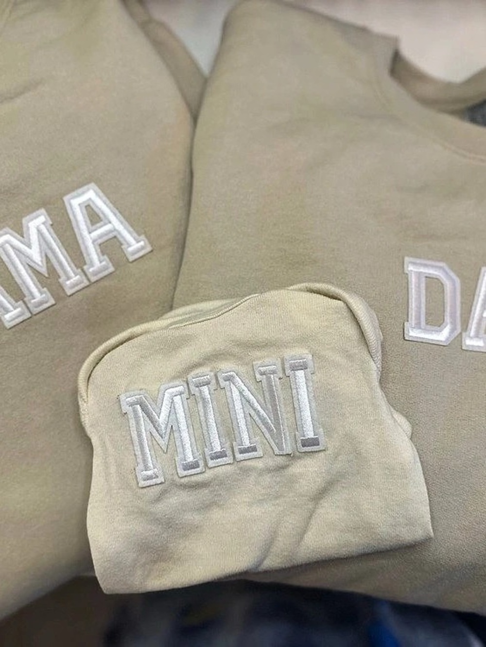 Mom, Dad, and Newborn matching outfits